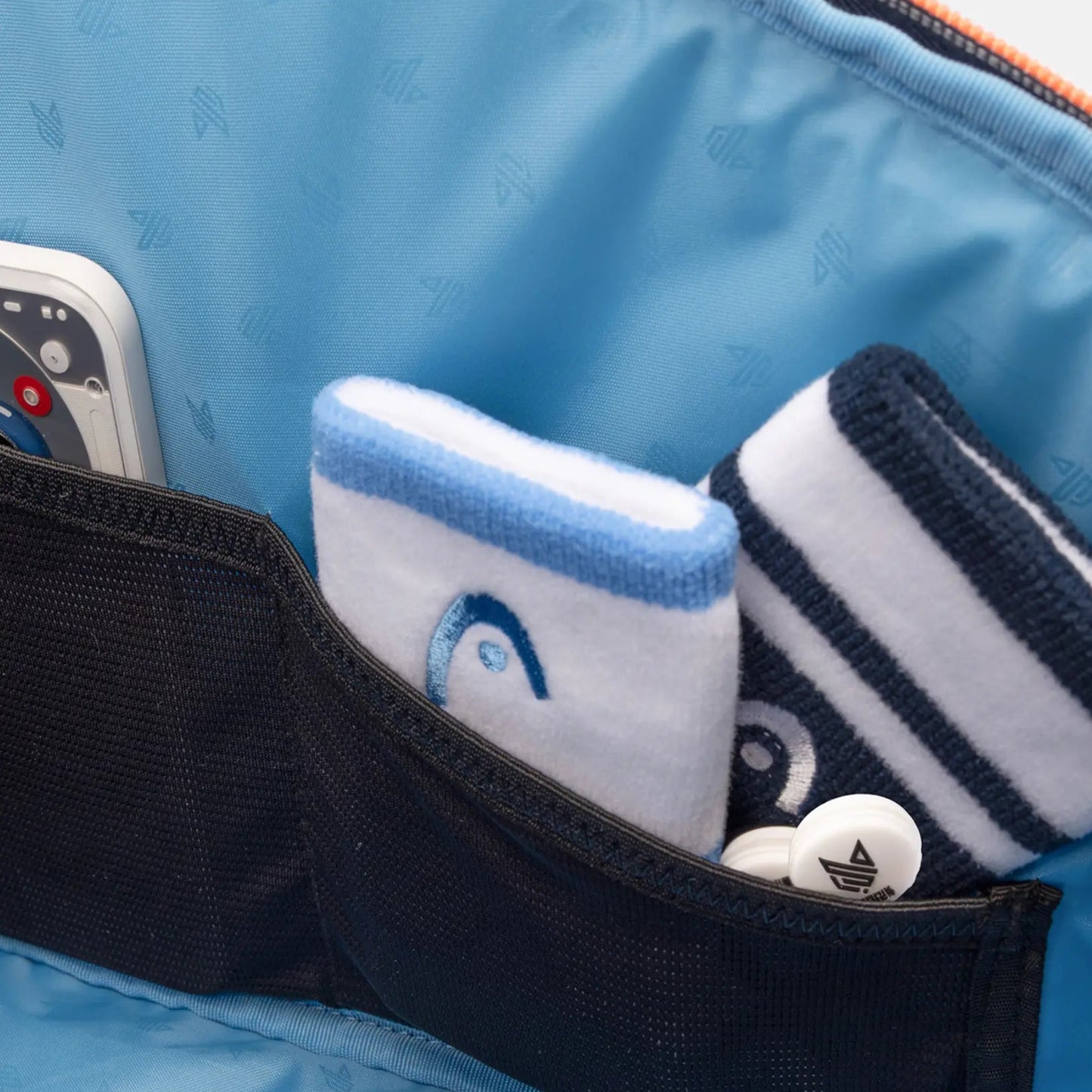 Detalhe do compartimento interior para acessórios do saco de raquetes de ténis L HEAD Pro em azul navy.