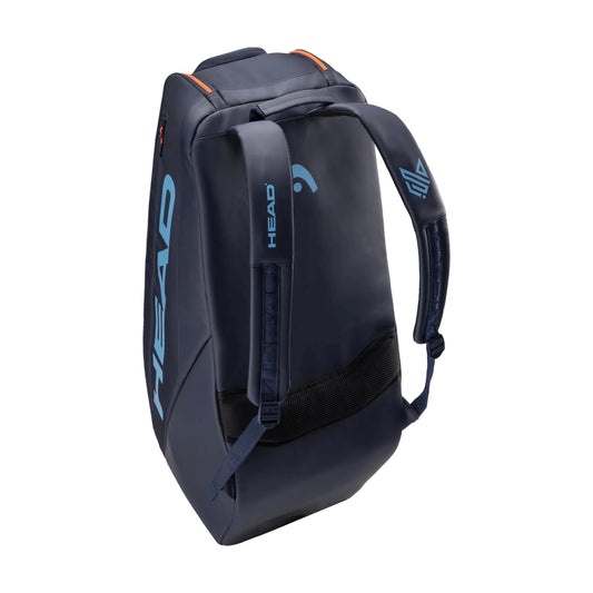 Vista de costas do saco de raquetes de ténis L HEAD Pro em azul navy, mostrando as alças.